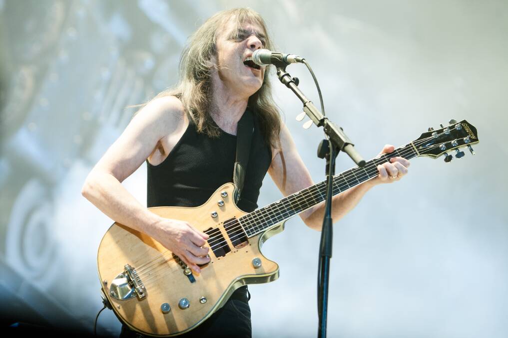 BALLBREAKER: Malcolm Young's crunching rhythm guitar was essential to AC/DC's sound, but he played a key role off stage as the band's leader.