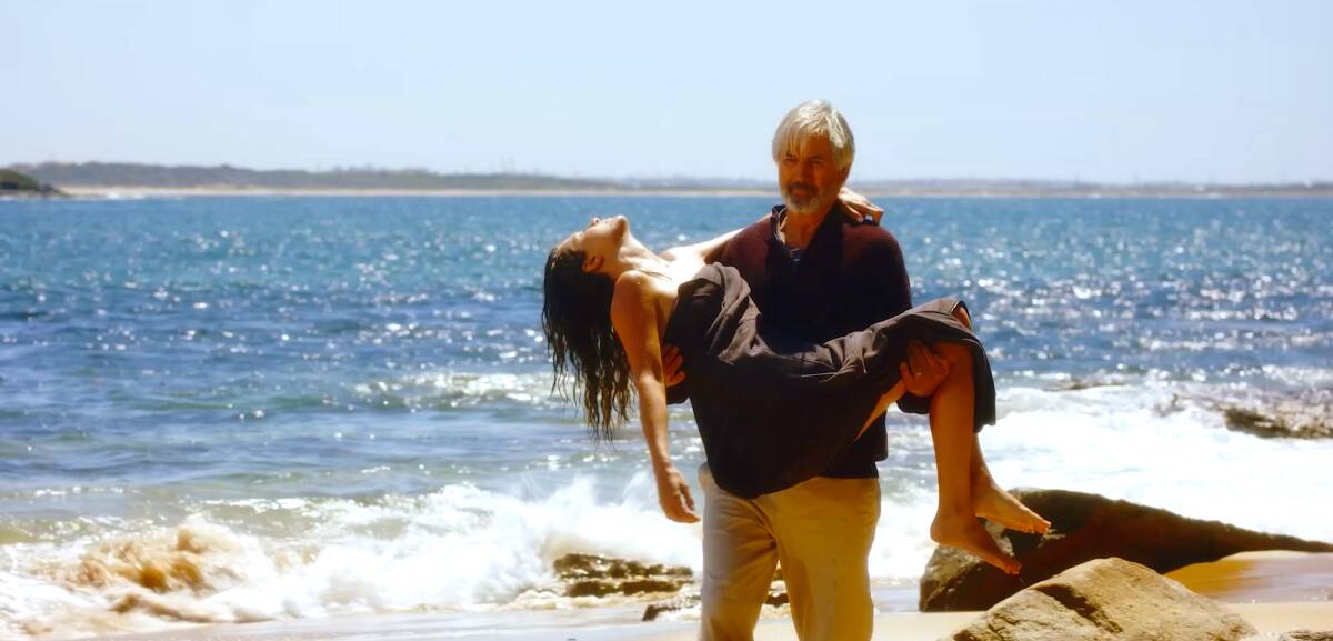 FISH OUT OF WATER: John Jarratt finds Allira Jaques' character washed up on a beach.