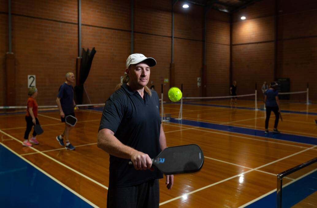 Tony Morgan is a pickleball coach, Australian representative, a commentator and even sells the paddles and balls. Picture by Jonathan Carroll