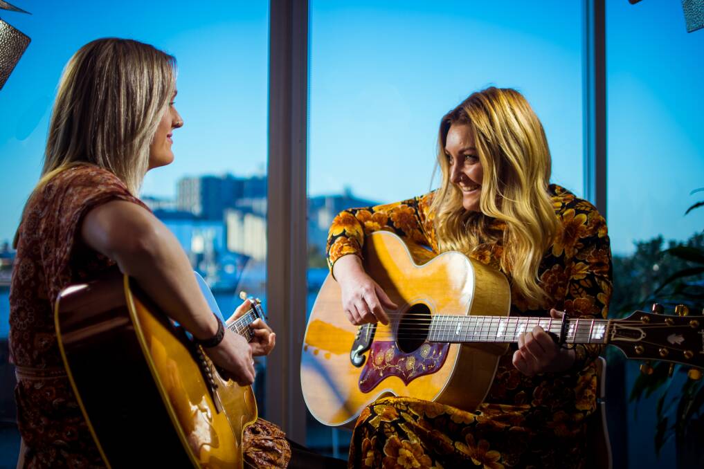 ALL SMILES: Natalie Henry, right, performing for the Herald Sessions video series with Emily A Smith. Picture: Simon McCarthy