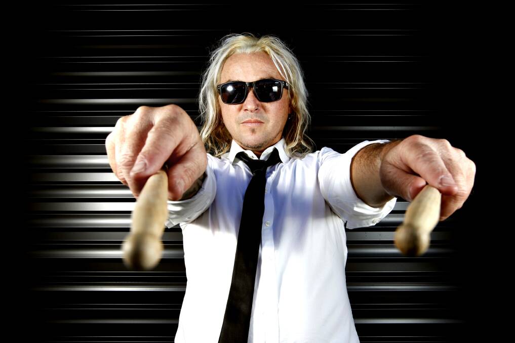 DRUMMER BOY: Craig "Rosie" Rosevear will momentarily cast off his real estate auctioneer suit to return to The Screaming Jets.