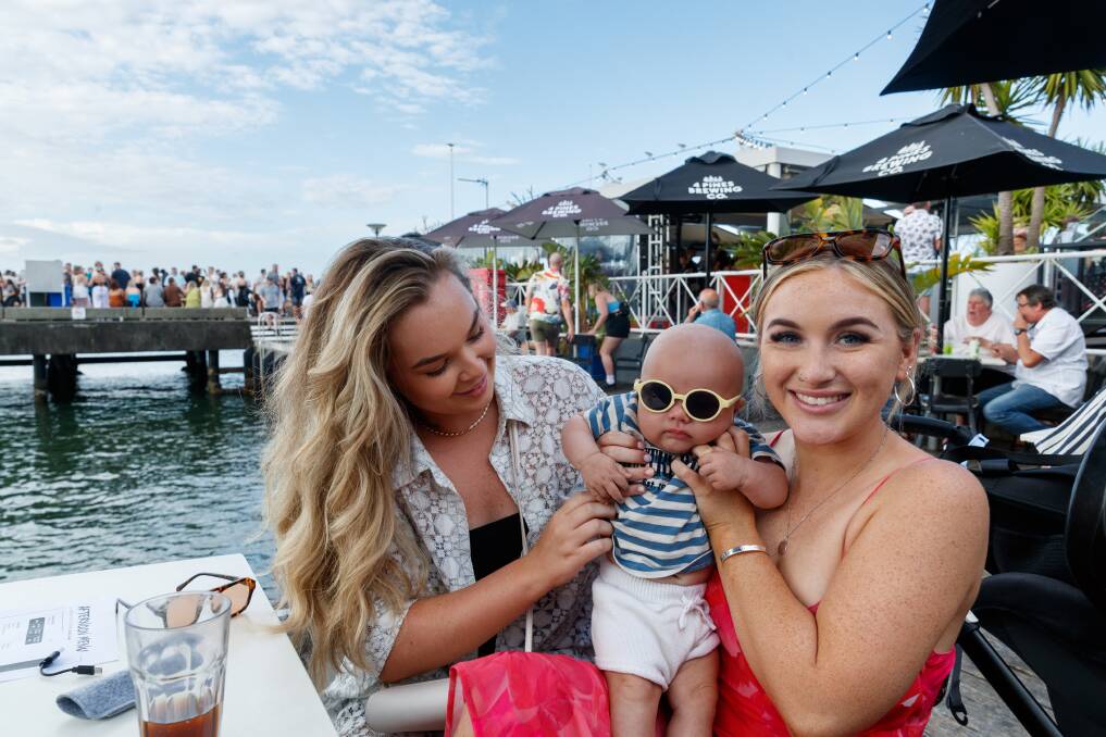 Law student Jazzy Miles, left, enjoyed her first Newcastle New Year's Eve with her cousin Grace Johnson and her three-month-old son Connor. Picture by Max Mason-Hubers