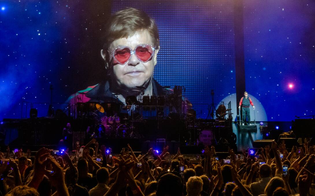 GOODBYE: An emotional Elton John takes a final look at his adorning Hunter Valley audience on Saturday night before walking up the yellow brick road. Picture: Paul Dear