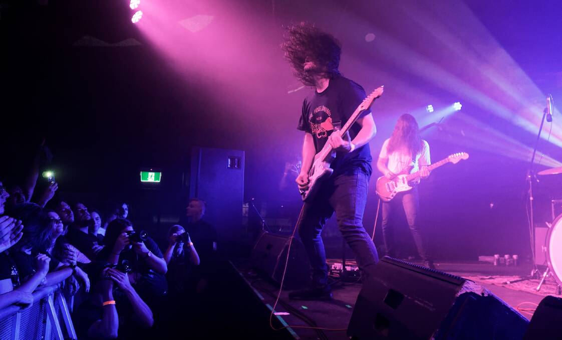 LIVE AND HEAVY: Shane Parsons and Lachlan Ewbank on stage in March when DZ Deathrays performed at the University of Newcastle's Bar On The Hill. Picture: Paul Dear