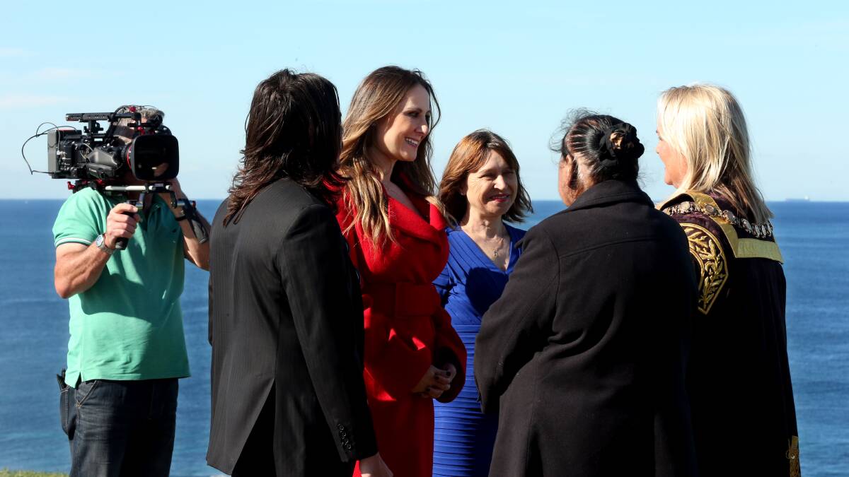 SHOW TIME: Jackie Gillies receiving the key to the city from Lord Mayor Nuatali Nelmes at Fort Scratchley while the Real Housewives Of Melbourne cameras roll. Picture: Simone De Peak