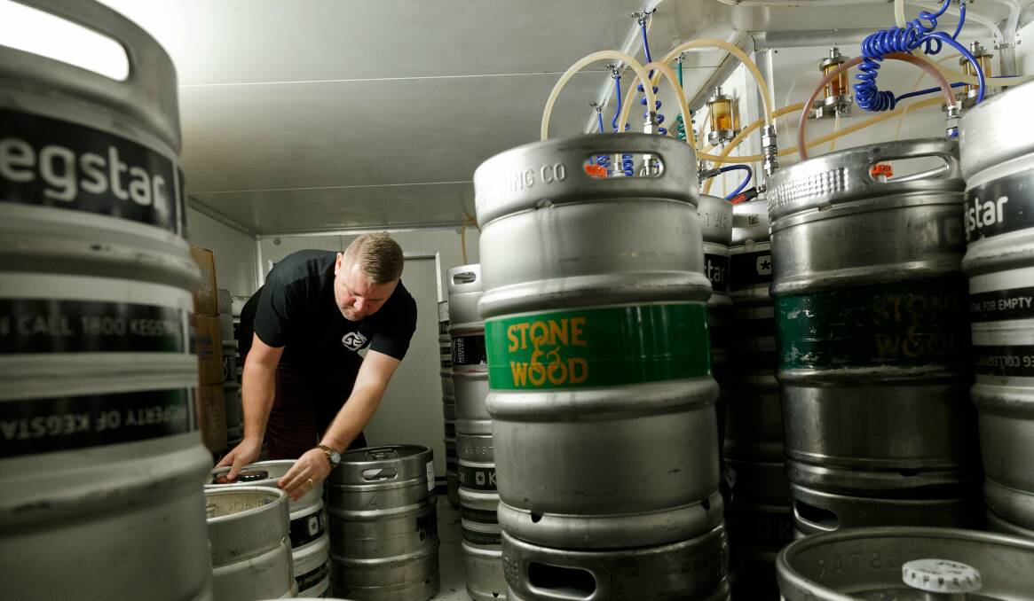 FORTHRIGHT: Corey Crooks attending to his kegs, which only contain Australian independently made craft beer. 
