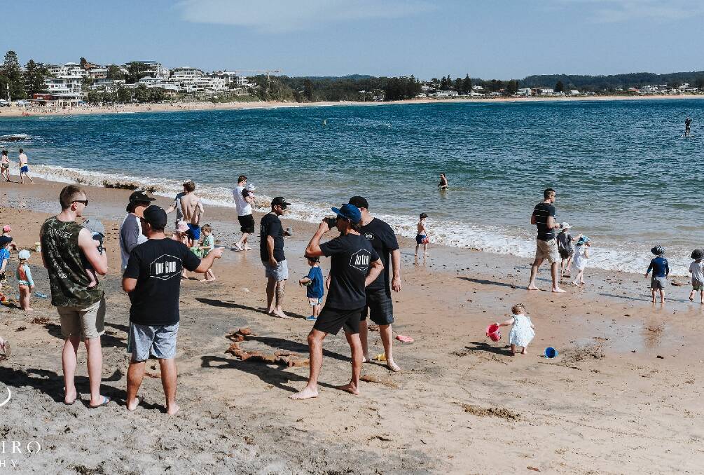 HANGING OUT: DILF Club members catching up at Terrigal beach. Picture: Brooke Biro