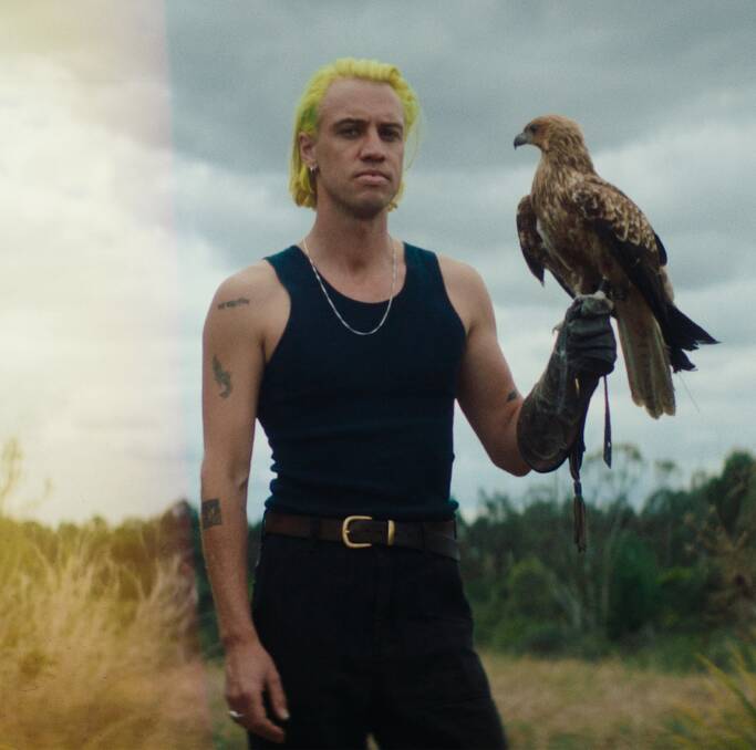 Atlas Franklin Alexander with a hawk during the filming of Young Love's video clip. Picture supplied