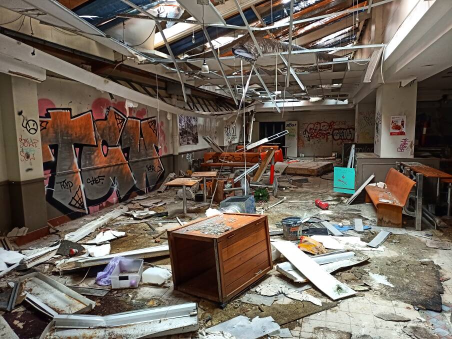 The collapsed ceiling of the old food court. Picture by Nev Dennard