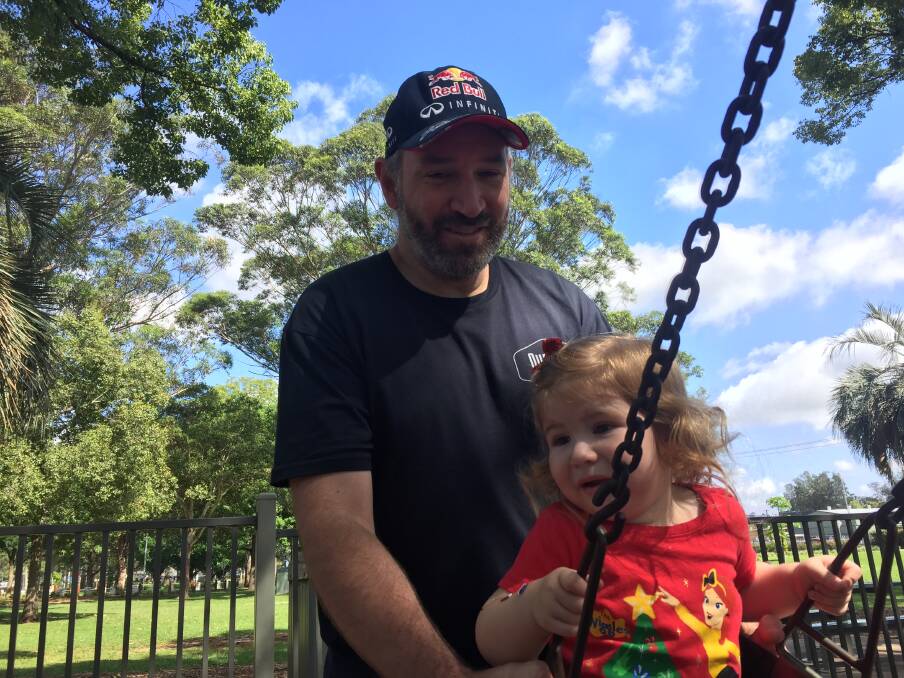 IN THE SWING: Hunter DILF Club organiser Jason Gray with his daughter Charlotte, 2. Picture: Josh Leeson