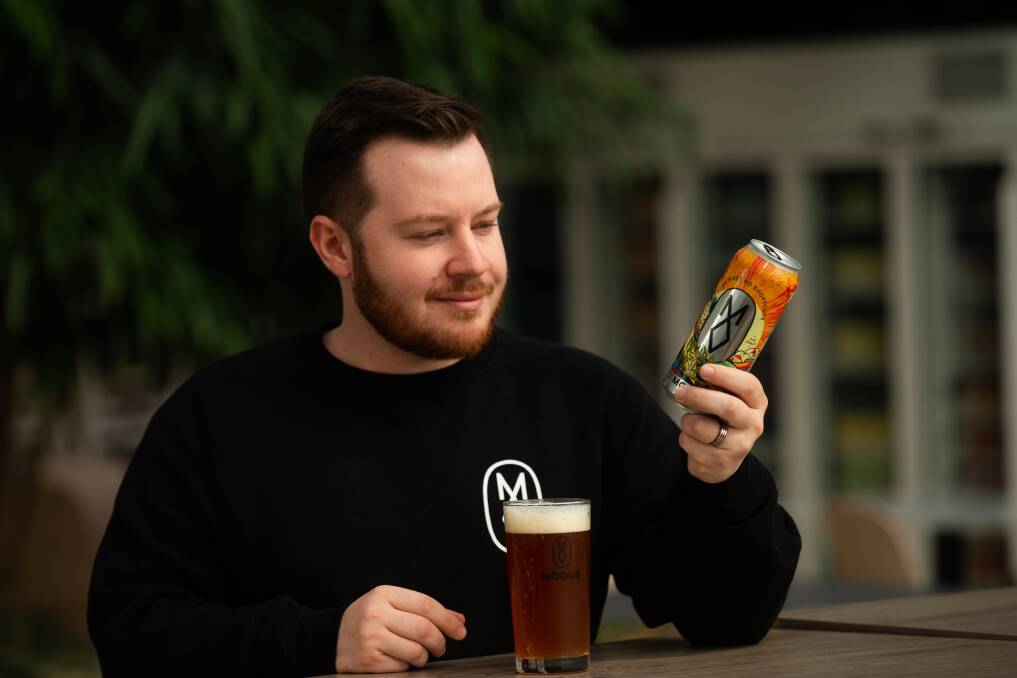 Modus digital marketing manager, Sam Evans, with the Neural Network East Coast IPA. Pictures by Jonathan Carroll