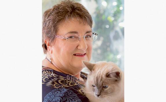 Speaking out: Scam survivor Marshall and her cat Cookie.