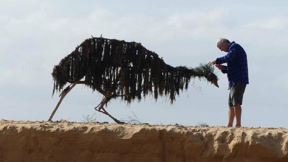 Sculptor Peter Rush gives his emu a trim at Avoca. Photo: Peter Rush
