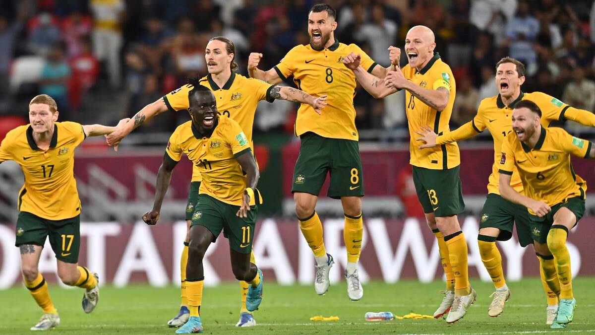 Australia celebrates after beating Peru 5-4 on penalties to qualify for the FIFA World Cup 2022. Photo: EPA/Noushad Thekkayil