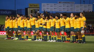The Wallabies singing the national anthem before the Tri Nations Rugby at McDonald Jones Stadium in November 2020. Picture by Jonathan Carroll