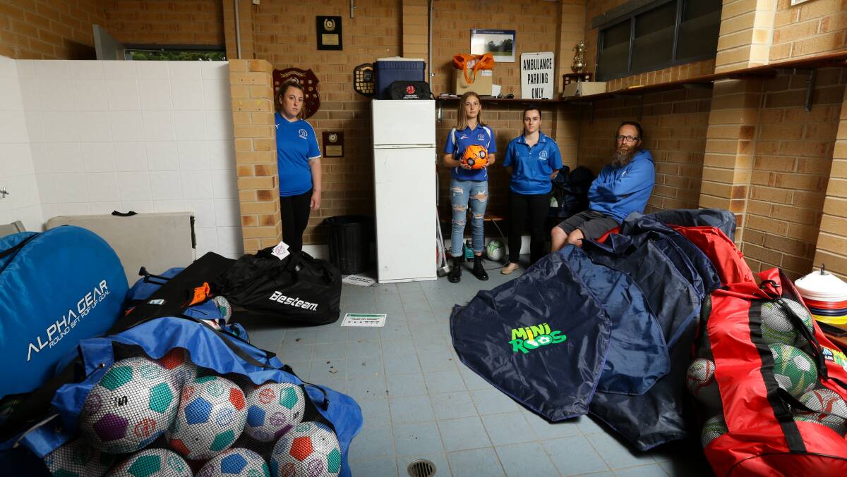 DATED: Garden Suburb Football Club players Lauren Priestly, Elise Allen and Ashleigh Corbett and president Lenny Allen in the changeroom. Picture: Jonathan Carroll