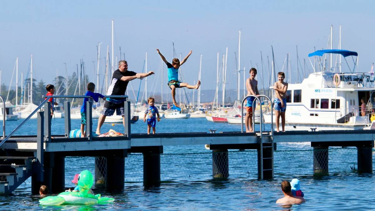 WATER: Families cooling off in Belmont Baths.