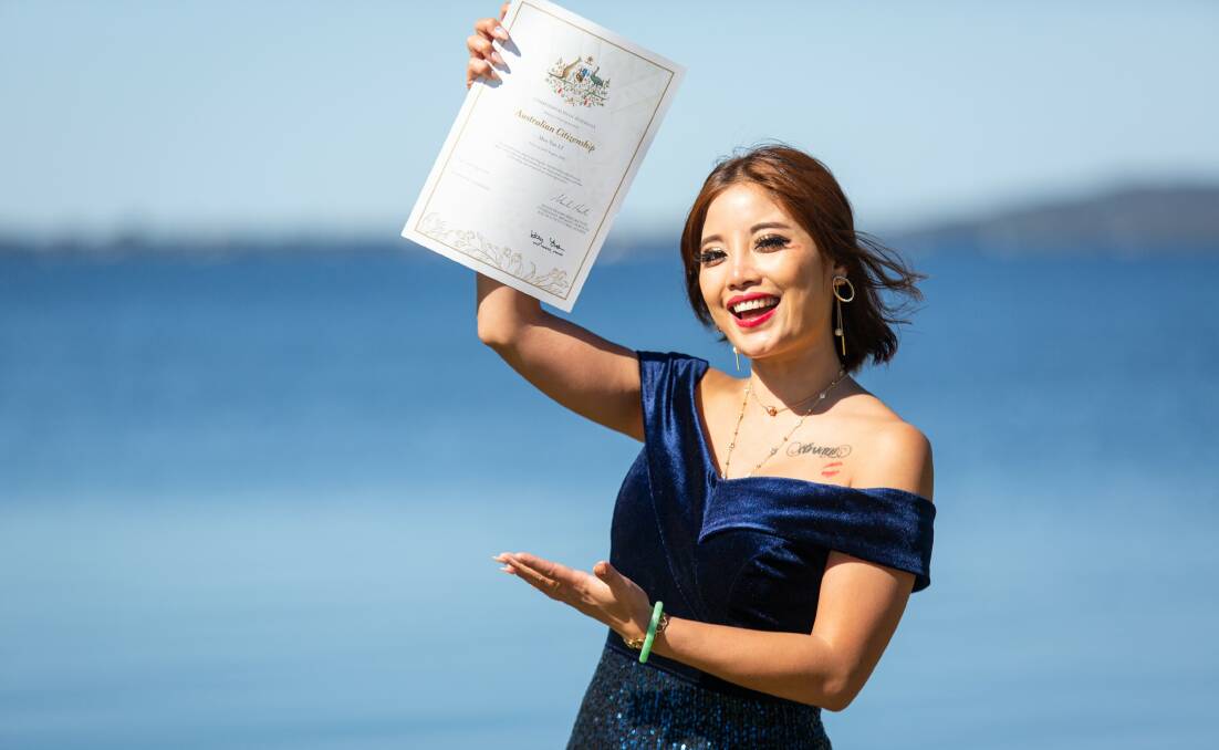 ALL SMILES: Hong Kong native Neko Li officially became an Australian Citizen in Lake Macquarie on Friday. Picture: Lake Macquarie City Council