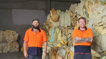 RECYCLING: Soft Landing Newcastle manager Josh Glanville and staff member Ryan Cross. Picture: Supplied