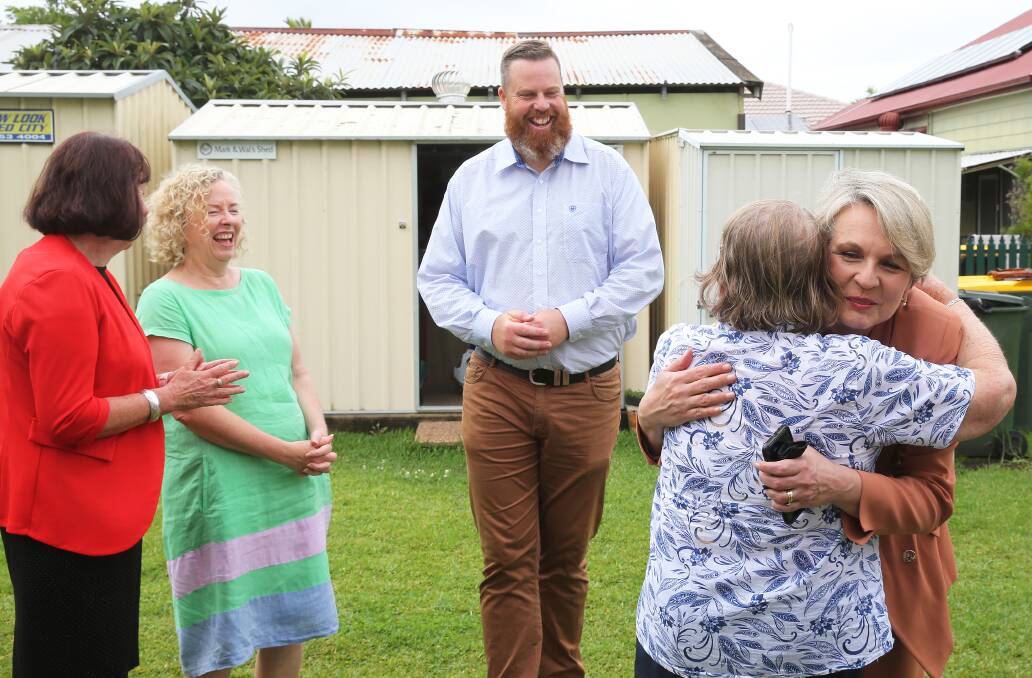 FUNDS: Mum's Cottage founder Helen-Anne Johnson hugs Tanya Plibersek, alongside Lake Macquarie mayor Kay Fraser, Newcastle MP Sharon Claydon and Hunter candidate Dan Repacholi.