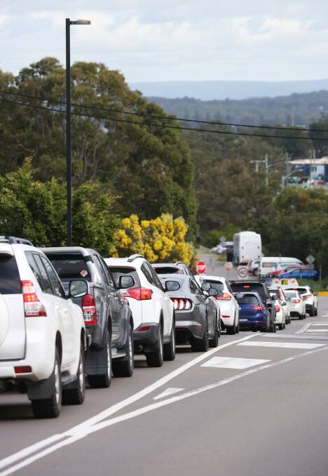 SPIKE: Cars lined up waiting to be tested for COVID-19 at Hillsborough this week after stronger restrictions were introduced across the state. Picture: Simone De Peak