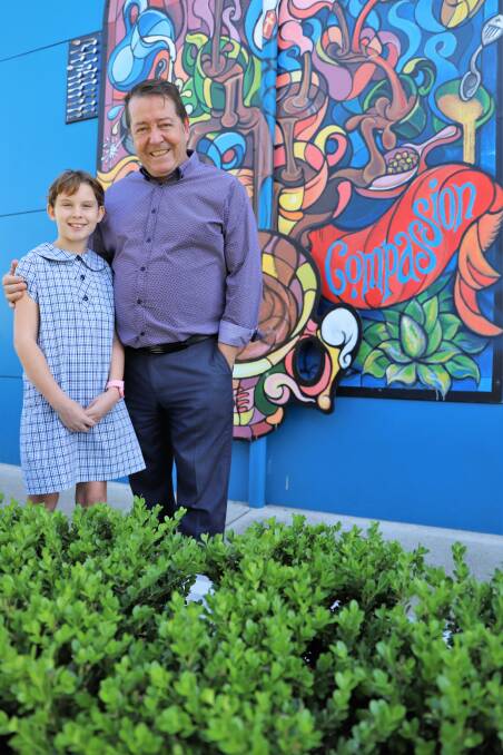 Mollyjane Boyson with St Therese's Primary New Lambton principal Duilio Rufo. Picture: supplied