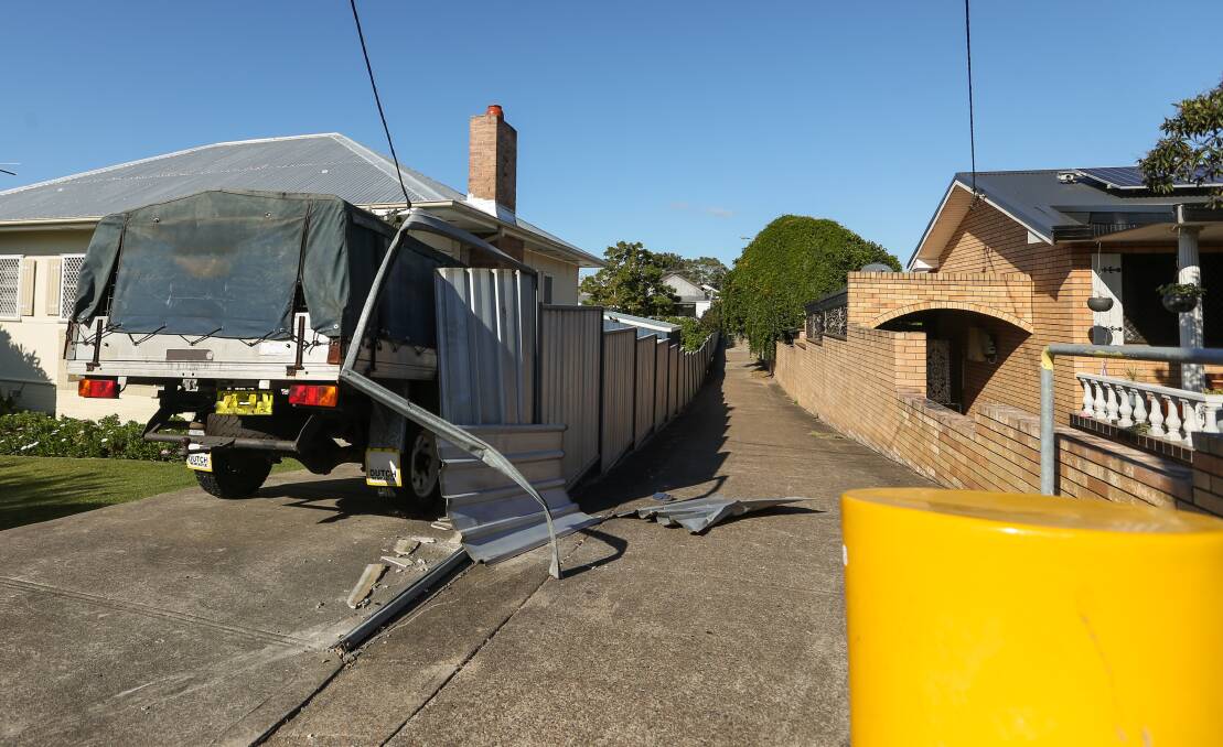 PURSUIT: Damage to the fence on McDonald Street, Telarah caused by a Holden Commodore police were chasing. Pictures: Marina Neil