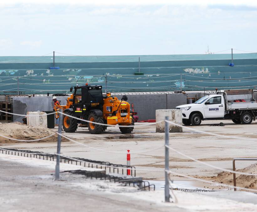 Construction crews at Newcastle Ocean Baths earlier this week. Picture by Peter Lorimer