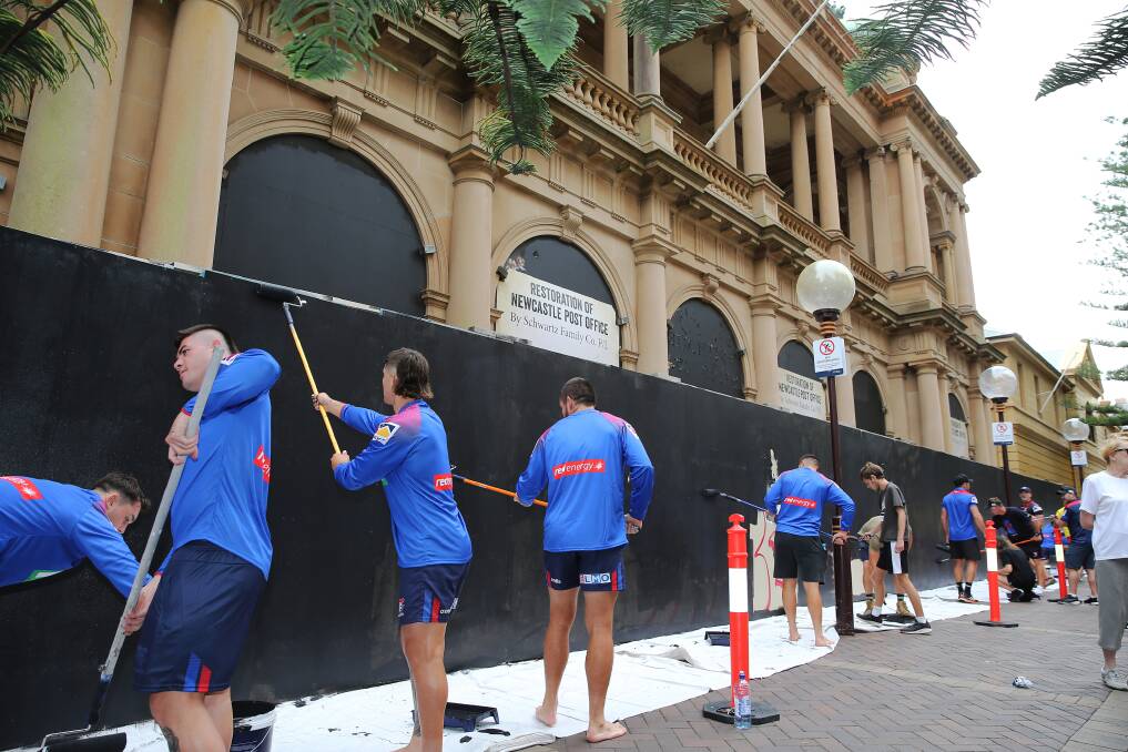 Newcastle Knights players taking part in Jeff McCloy's graffiti drive at the old Newcastle post office last month. Picture: Peter Lorimer