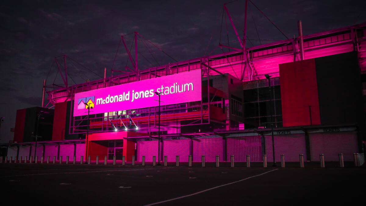 McDonald Jones Stadium lit up pink in anticipation for the concert.