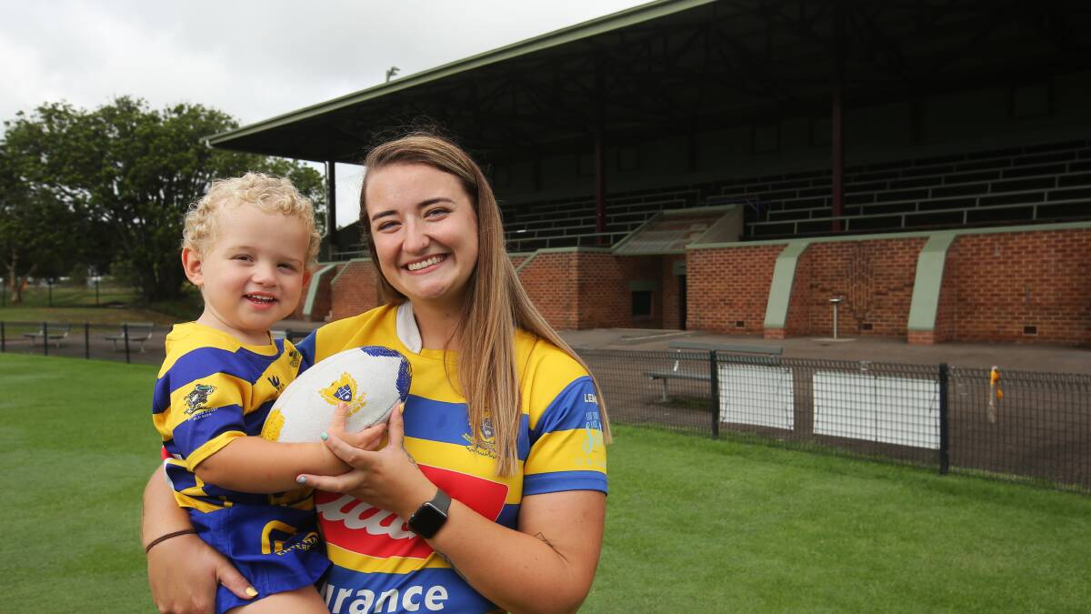 Hamilton Hawks women's division player Vivien Clay with son William Clay at Passmore Oval, which will receive designated women's change rooms. Picture by Simone De Peak