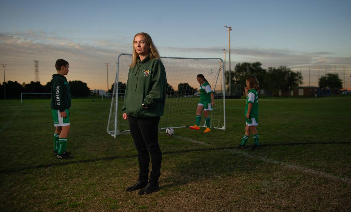 TOUGH: Mayfield United Junior Soccer Football Club vice president Susan Kay, pictured with players, said expectations of volunteers were too much. Picture: Marina Neil 