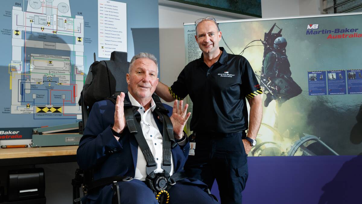 English cricket legend turned UK trade envoy Sir Ian Botham visited Martin-Baker Australia at Williamtown, where they manufacture ejection seats for fighter jets. Pictured with Andrew Eden, managing director of Martin-Baker Australia. Picture by Max Mason-Hubers