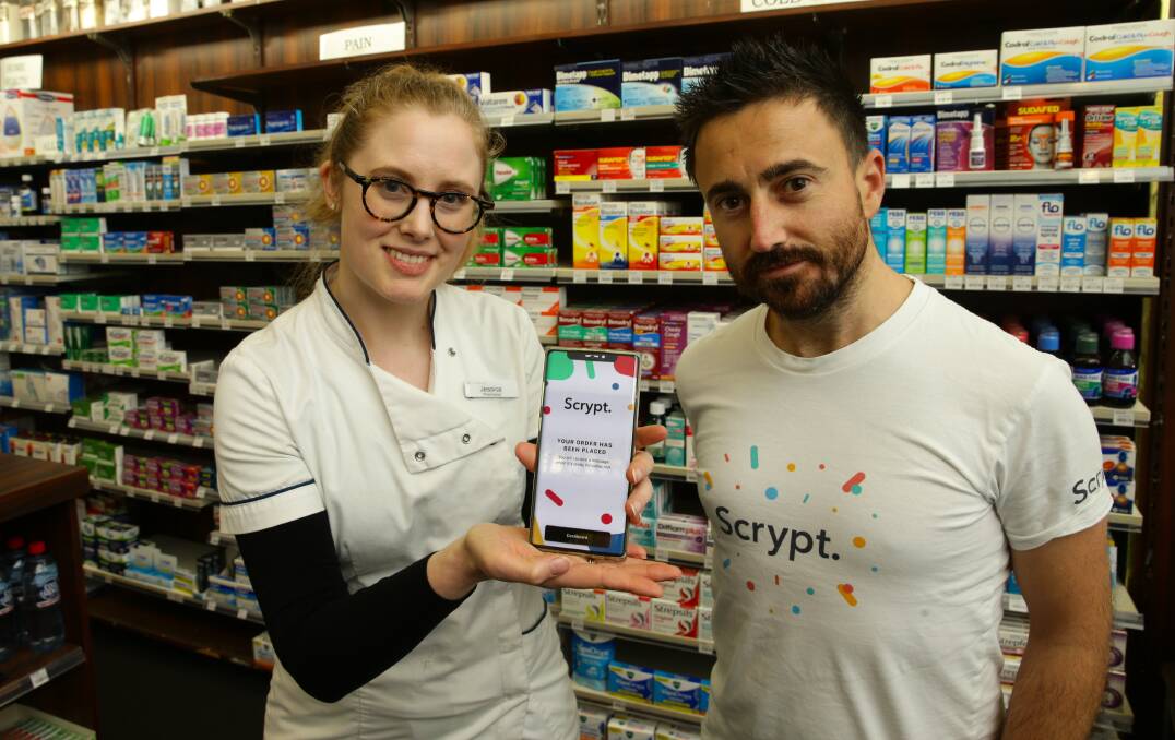 NEW: Newcastle City Pharmacy pharmacist Jessica Cahill with pharmacist and Scrypt director Lloyd Smith using the new e-prescription software. Picture: Jonathan Carroll