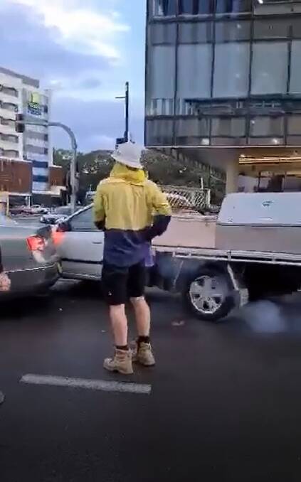 A still from the video, which shows the ute pushing its way through cars stopped at an intersection.