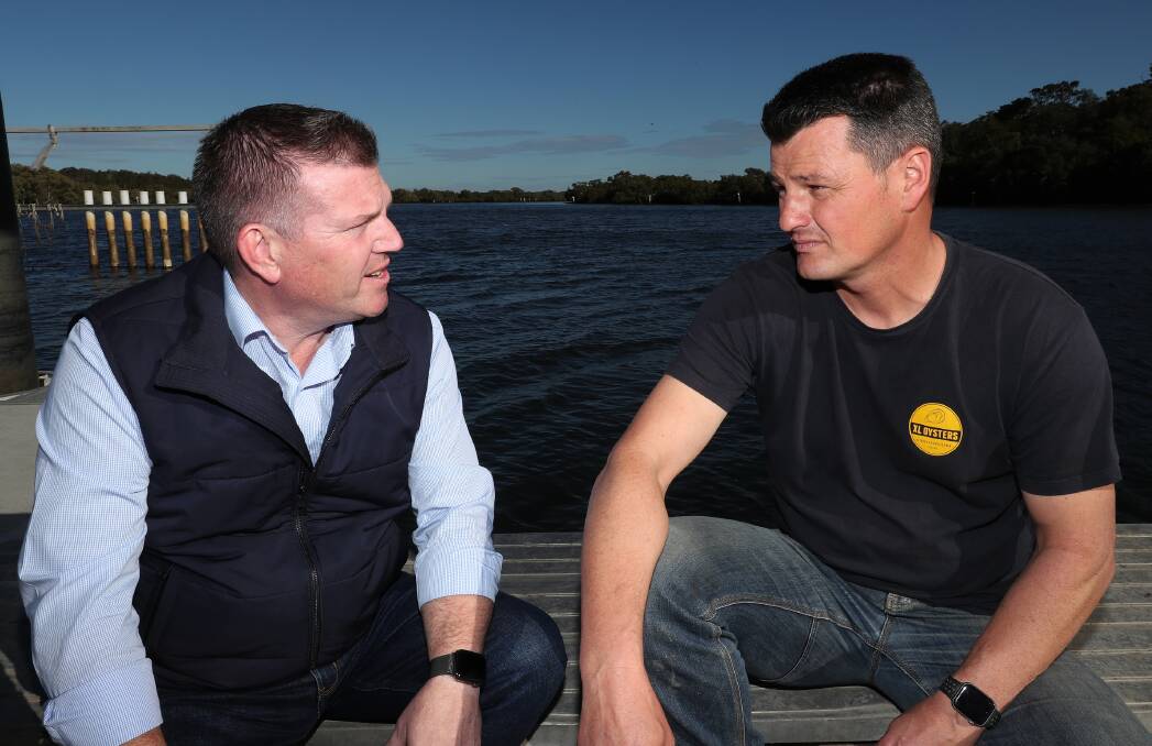 URGENT: Agricultural minister Dugald Saunders talks with Lemon Tree Passage oyster farmer Matt Burgoyne about the QX disease outbreak in Port Stephens. Picture: Peter Lorimer