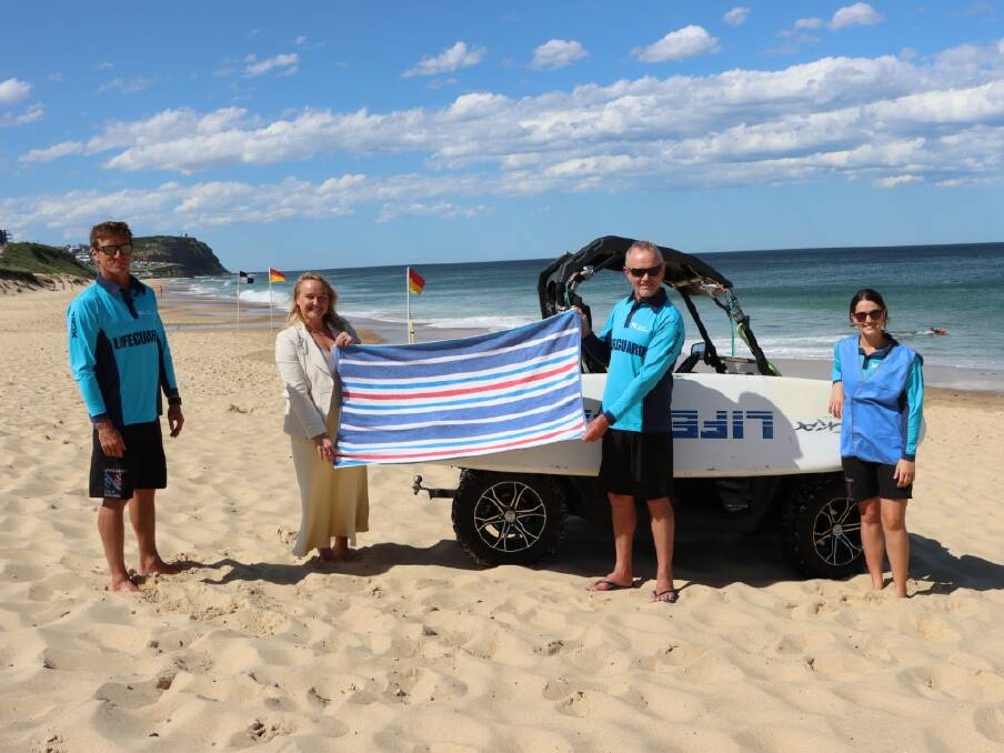 SAFE: Lord Mayor Nuatali Nelmes with lifeguards Scott Hammerton, Gary Richards and Seraina Danuser encouraging people to keep a towel length away from others.