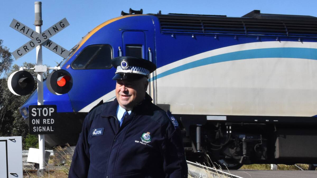 LOOK: Traffic and Highway Patrol Command Senior Sergeant Michael Timms at the Oakhampton level crossing on Monday. Picture: Sage Swinton