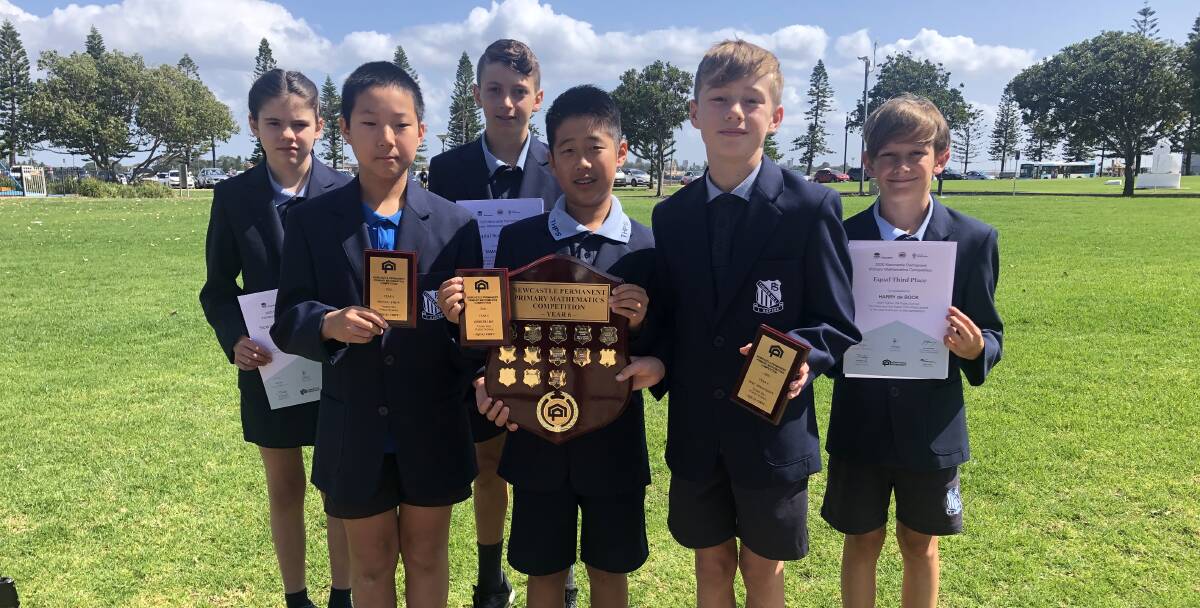 WELL DONE: Tighes Hill Public School students, at back, Sofia Stojko, Tama Besuijen and Harry De Bock, and at front, Wenyu Zhou, Dimitri He and Isac Johansson with their Newcastle Permanent Primary School Mathematics Competition awards.
