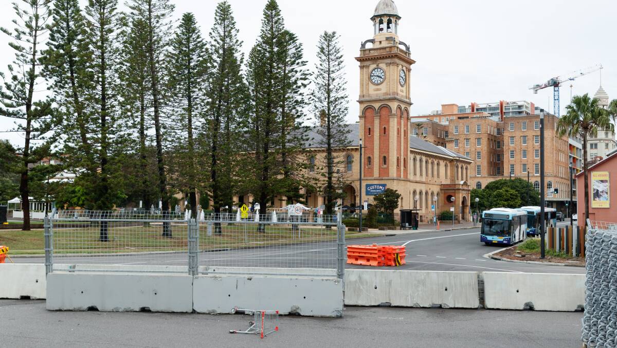 Supercars track work in Watt Street on Monday, the deconstruction is scheduled for completion this Friday. Picture by Max Mason-Hubers