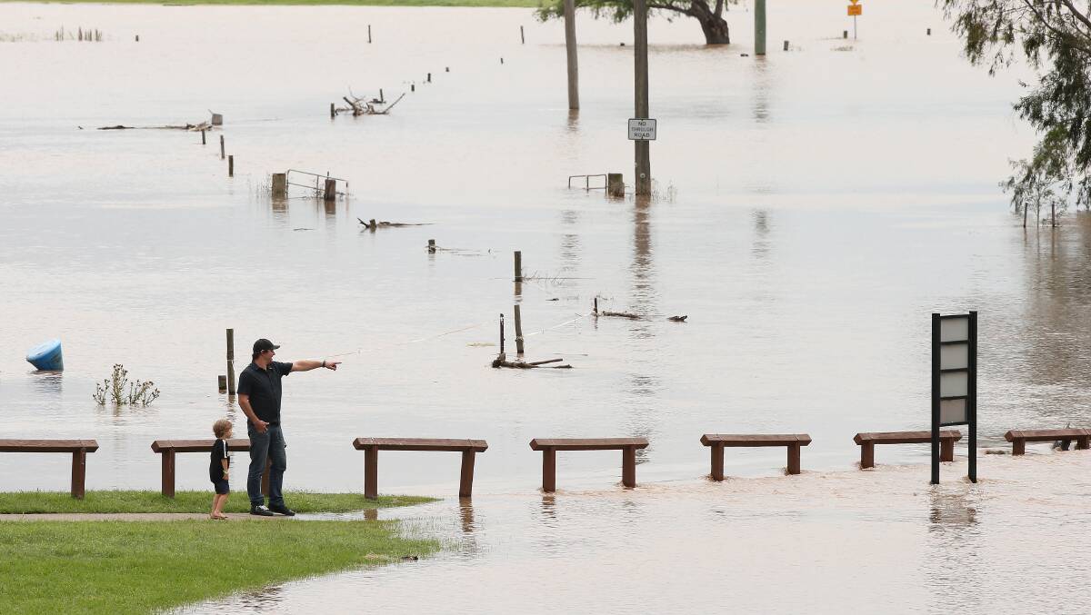 WET: The Hunter River bursts its banks upstream of Morpeth on Monday. Picture: Peter Lorimer