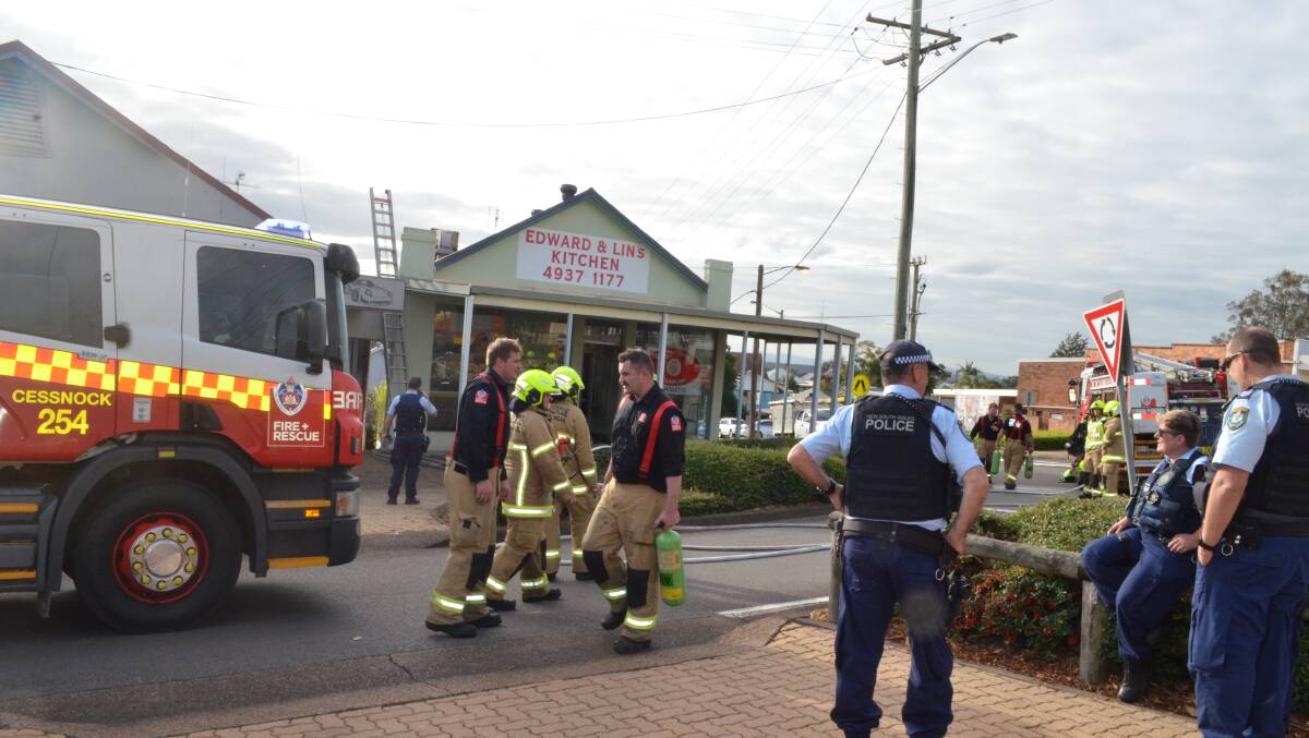 Emergency services on the scene of a fire in Lang Street, Kurri Kurri on Friday. Picture: Krystal Sellars