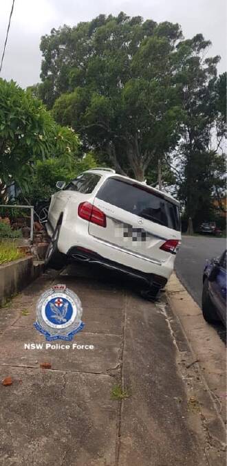 The vehicle collided with a retaining wall where it became lodged. Picture: NSW Police