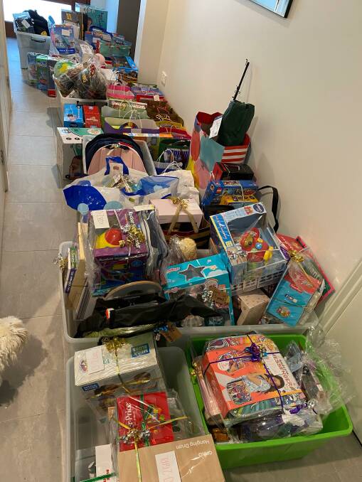 HAUL: Ms Higgins donated more than 100 presents to Barnardos on Friday.