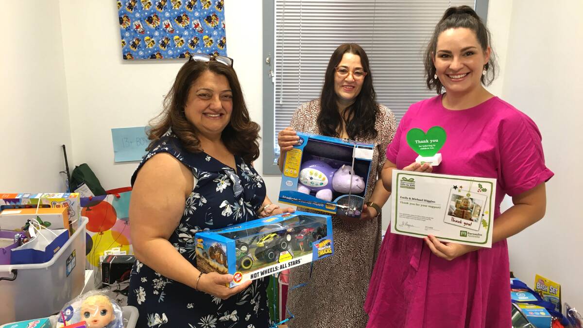 TOYS: Mary and Belinda from Barnardos and Emily Higgins with some of the donations.