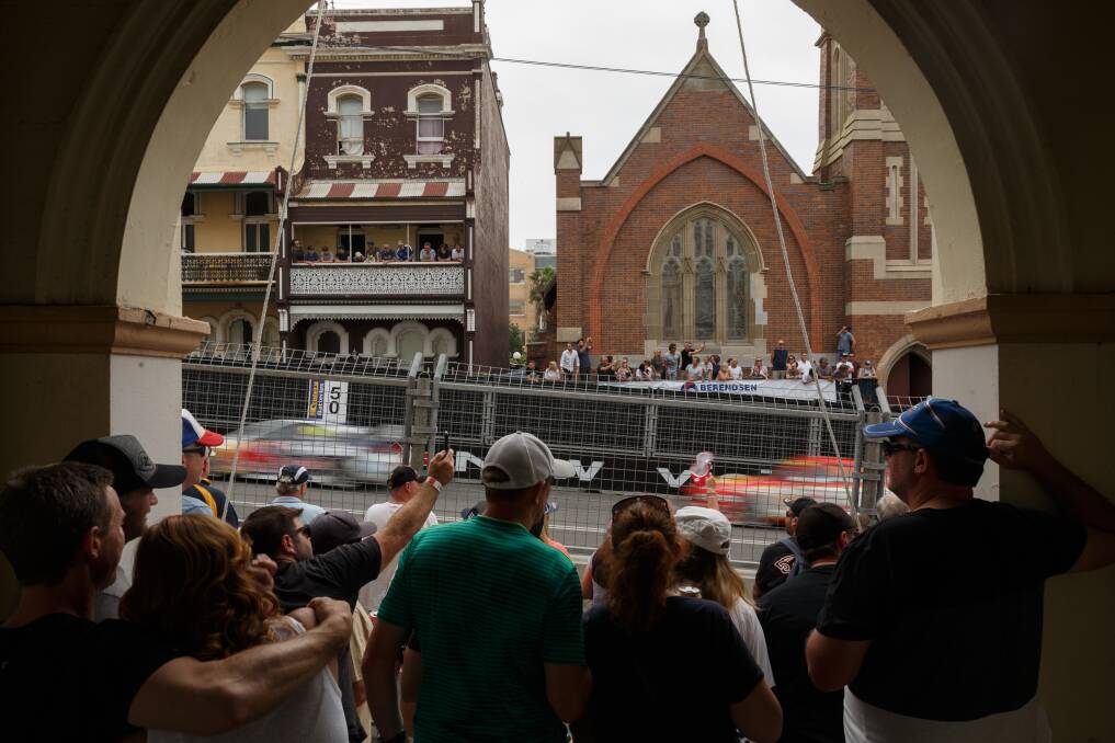 CROWD: Spectators watch the 2019 Supercars event from the United Service Club on Watt Street. Picture: Max Mason-Hubers