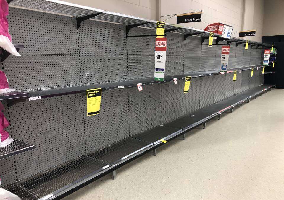 EMPTY: The toilet paper shelves at Woolworths Marketown, where a limit of two packs per customer has been introduced in response to increased demand.