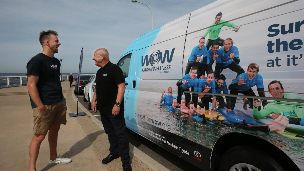 HELPING HAND: Waves of Wellness CEO Joel Pilgrim Founder and Newcastle Permanent Charitable Foundation chair Phil Neat in front of the new van. Picture: Simone De Peak