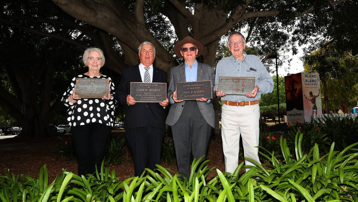 Rotary Club of Newcastle members Pat Glass, Pete Evans, John McNaughton and Ted Lewis with a selection of the new and old plaques in Civic Park. Picture by Peter Lorimer