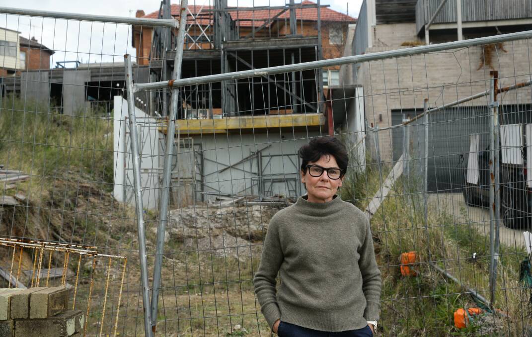 Judy Tynan in front of the building site next to her house in The Hill. Picture by Jonathan Carroll